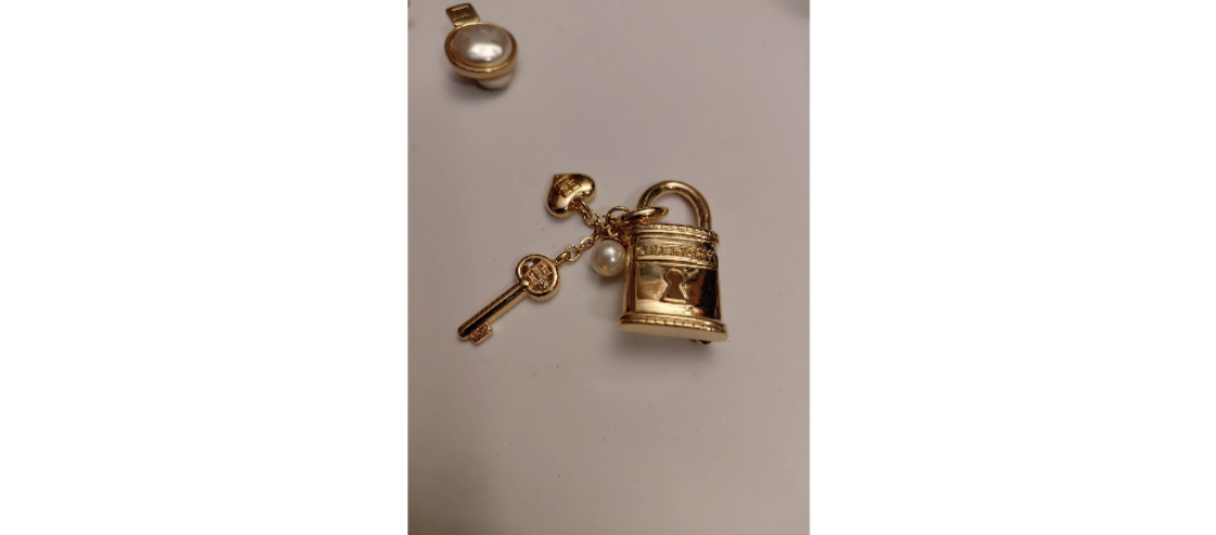 Vintage Givenchy lock and key brooch pin.