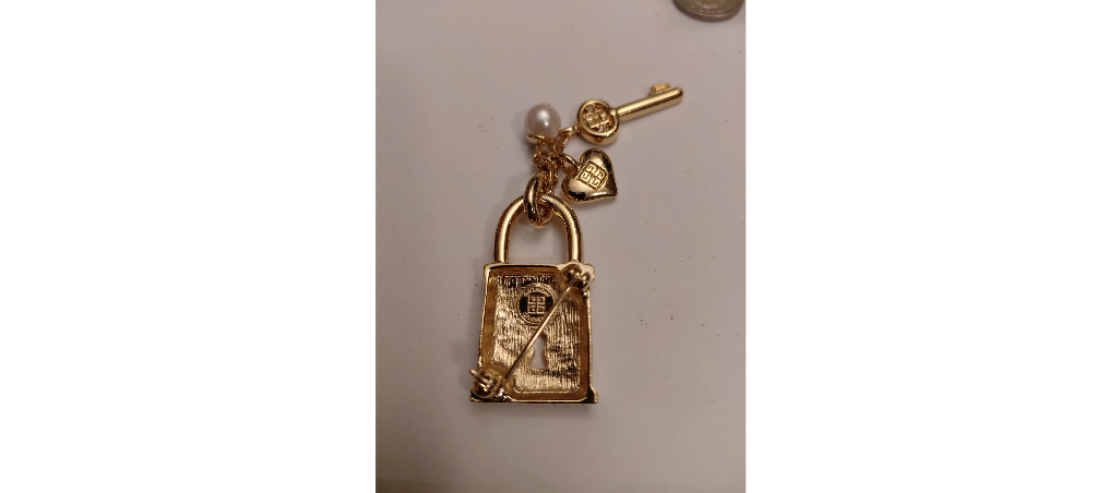 Vintage Givenchy lock and key brooch pin.