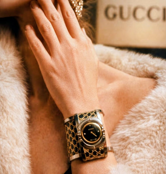 Gucci twirl stainless steel and gold tone women’s watch