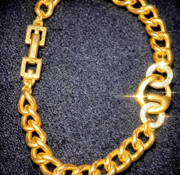Authentic vintage Givenchy thick gold tone G Logo With Crystals Bracelet Length 7 inch.